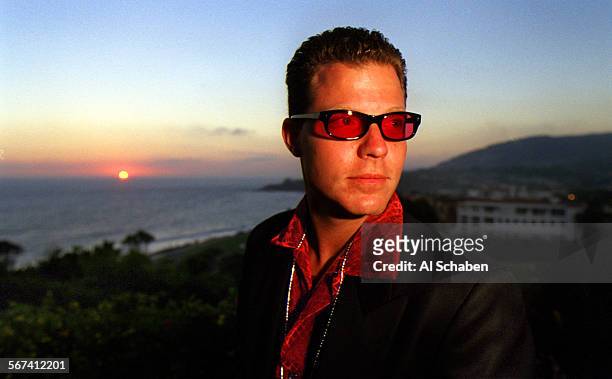 Surf.red.0803.ASDANA POINTKurt Menslage of Agoura Hills, sports red sunglasses and a red shirt as the sun sets at the Waterman's Ball, the Surf...