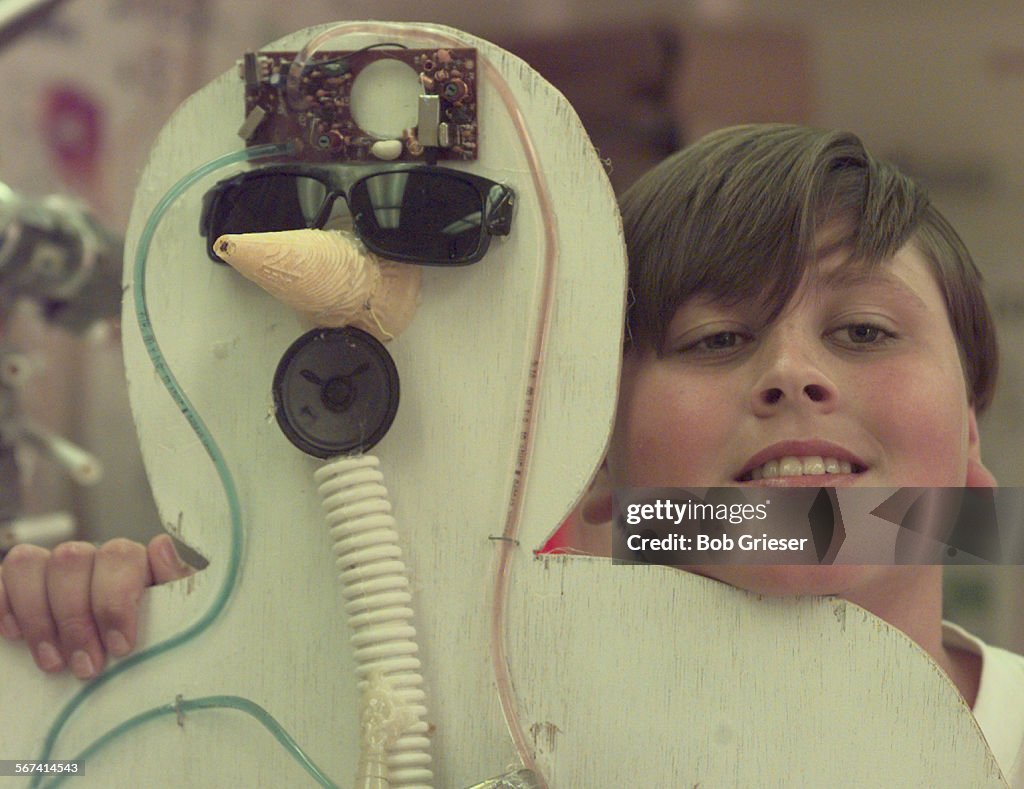 ME.Bodies.Ryan.1.BG.6May97Ryan Allcom with the head of his trash body using a phone mother board f