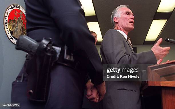 With Martin H. Pomeroy, Deputy Chief, Commanding Officer, LAPD, left, announced at a press conference at Garcetti's office in Los Angeles, April 24...