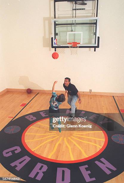 Basketball/Court.1026.GKJeffrey Berkley and his son Eric Berkle y, age 7 ,as they go one on one at the basketball court at the home of Jeffrey and...