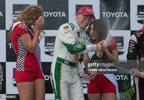 Mike Conway sprays champagne towards the crowd after winning the Toyota Grand Prix of Long Beach on April 13, 2014 in Long Beach, California.