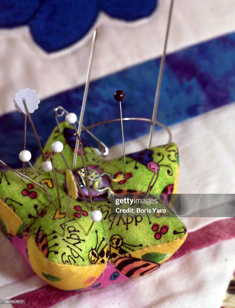 This "ladybug" pin cushion was crafted by members of the Valley Quiltmakers Guild. ^^^/LA Times