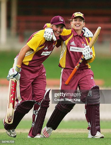 Megan White and Jodie Purves of the Fire celebrate hitting the winning runs during the 2nd Final between the New South Wales Breakers and the...