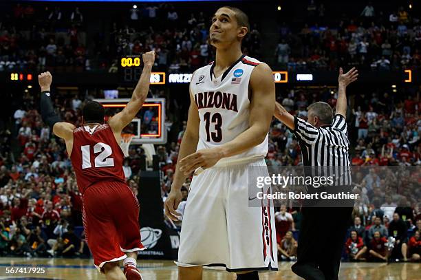 Arizona guard Nick Johnson shows his frustration after missing the potential game winning shot at the end of overtime as Wisconsin wins 64-63 in the...