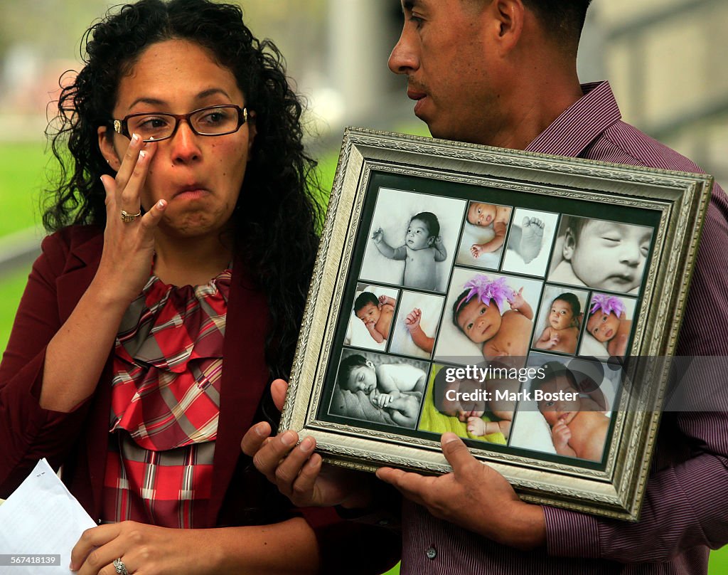 NORWALK, CA., MARCH 24, 2014: Alejandra Gonzalez and Miguel Chavez hold photos of their daughter Mia