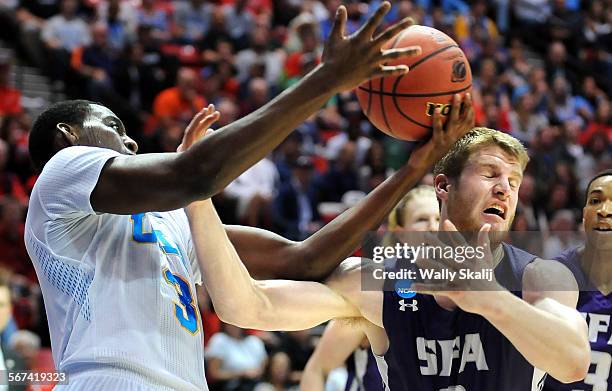 S Jordan Adams battles for a rebound with Stephan F. Austin's Nick Kazemi in the 1st half in the Third Round of the NCAA Tournament at Viejas Arena...