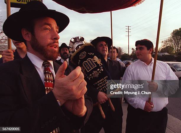 New Torah bound for the West Valley Hebrew Academy in Woodland Hills, CA was greeted with music and celebration during Sunday afternoon's procession....