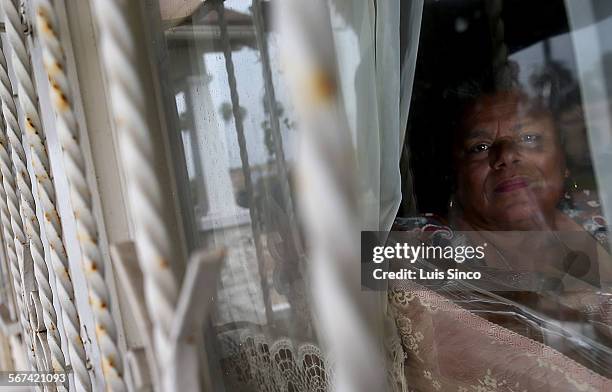 Rita Banks looks out the window of her home in the South Los Angeles neighborhood known as Chesterfield Square. Per capita, Chesterfield Square leads...