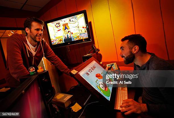 Steve Borst, left, and Gary "Doodles" Di Raffaele, right, work on the new animated comedy "Breadwinners" at the Nickelodeon Animation Studios in...