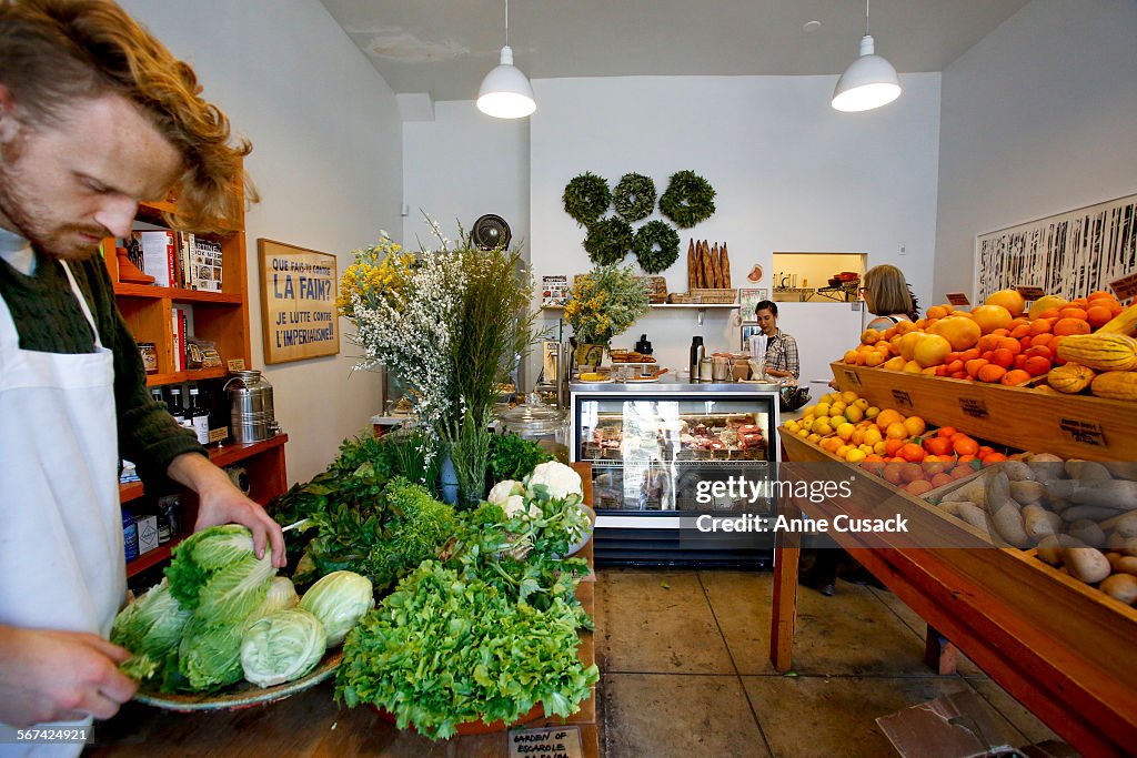 LOS ANGELES, CA. - JANUARY 22, 2014: Paul Bergmann (CQ) places fresh produce in a shop called Cookbo