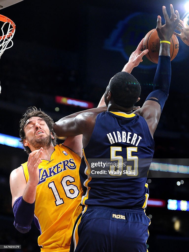 LOS ANGELES,CALIFORNIA JANUARY 28, 2014-Lakers Pau Gasol blocks the shot of Pacers Roy Hibbert in th