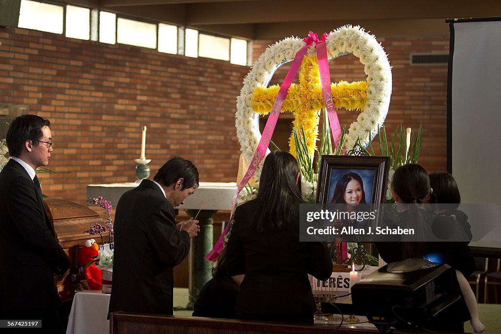 MIDWAY CITY, CA-JAN. 27, 2014:  Friends and family pay their respects as they attend a public viewin