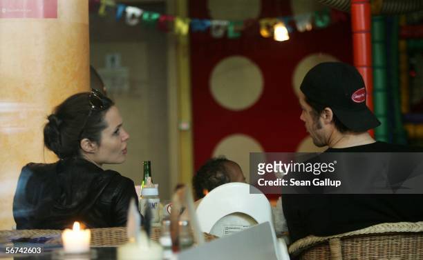 Actors Angelina Jolie and boyfriend Brad Pitt sit in the Pups family restaurant with Jolie's adopted children Maddox and Zahara February 4, 2006 in...