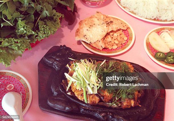 HaNoi.Fish.RDL At the Ha Noi Restaurant in Garden Grove, Cha Ca Thang Long (Barbecued fish on a sizzling platter. TIMES PHOTO BY ^^^