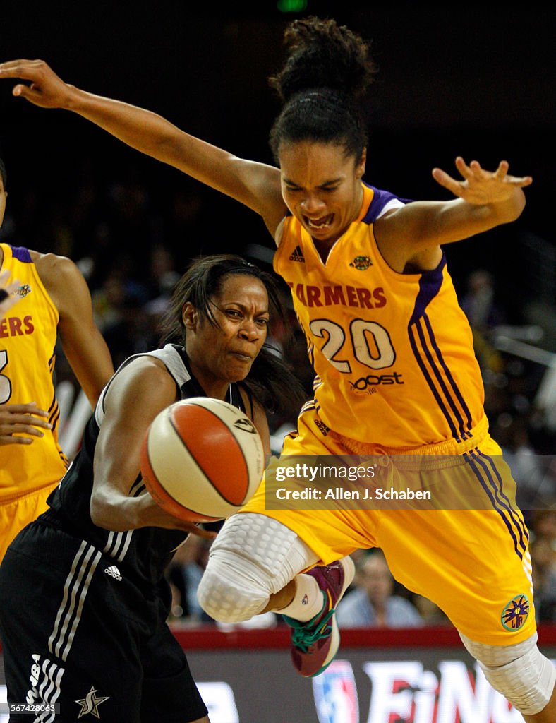 LOS ANGELES, CA  SEPT. 27, 2012: San Antonio Silver Stars guard Jia Perkins, left, knocks the ball 