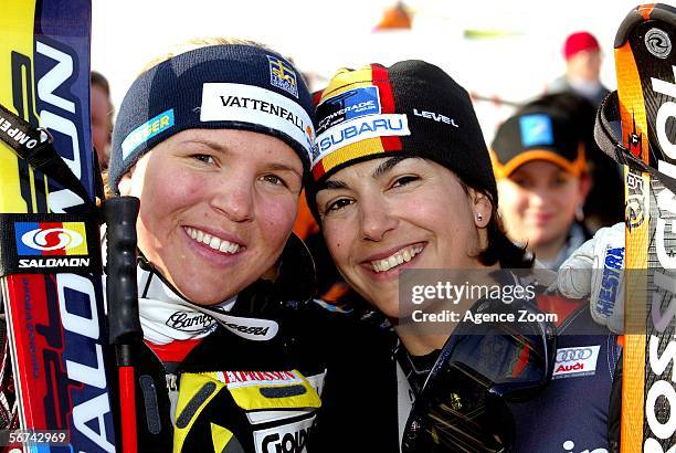 Maria Jose Rienda of Spain and Anja Paerson of Sweden celebrate during the FIS Skiing World Cup, Women's Giant Slalom on February 4, 2006 in...