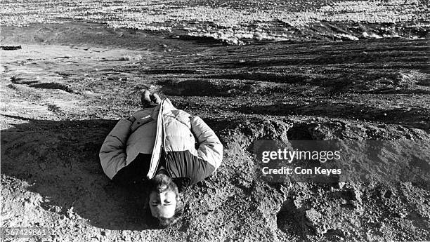 March 13, 1984  Published Caption: James Turrell lies near the center of Roden Crater and looks heavenward to check the celestialvaulting effect....