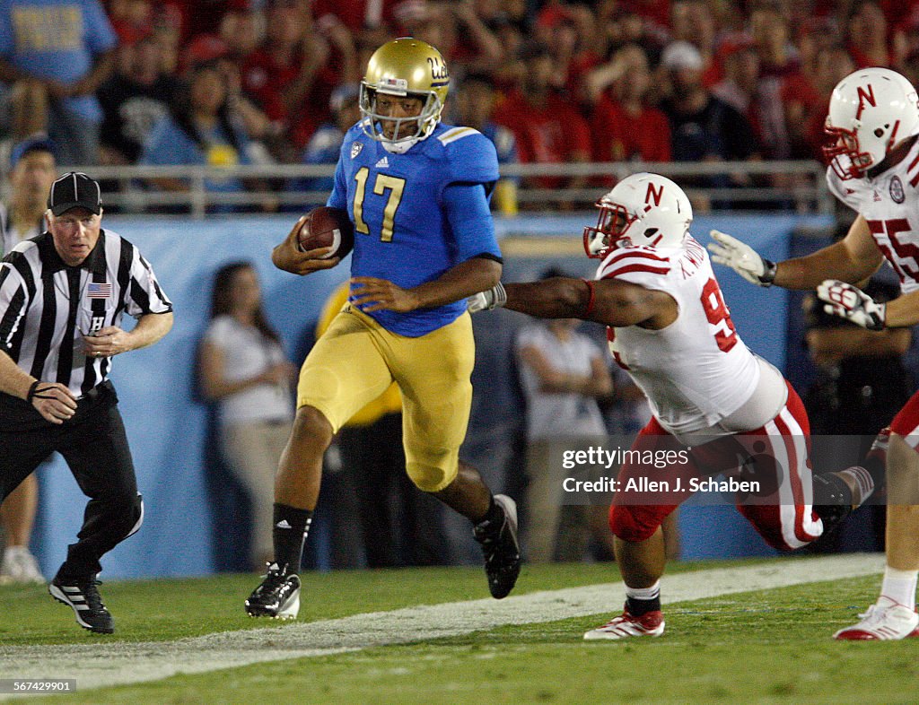 PASADENA, CA  SEPT. 7, 2012: UCLA quarterback Brett Hundley rushes for yardage past Nebraska defend