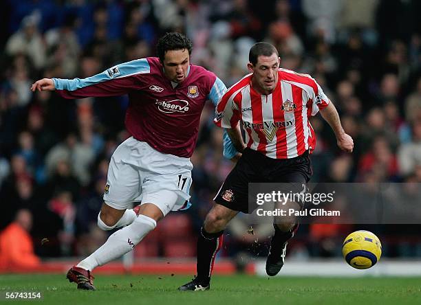 Stephen Wright of Sunderland battles for the ball with Hayden Mullins of West Ham United during the Barclays Premiership match between West Ham...