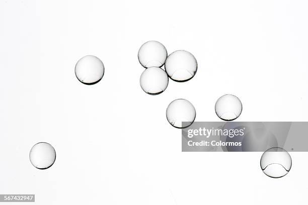 transparent beads on white background - bubbles white background stock pictures, royalty-free photos & images
