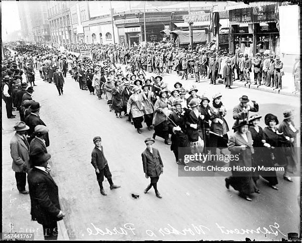 Elevated view of members of the Amalgamated Clothing Workers of America in a Labor Day parade, Chicago, Illinois, May 1915. 10,000 garment workers...