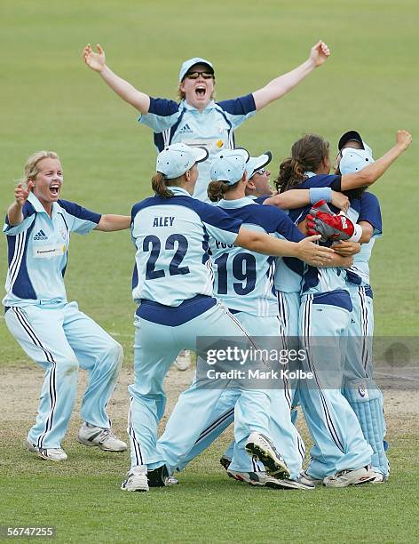 The NSW Breakers celebrate after winning the 3rd Final and clinching the series between the New South Wales Breakers and Queensland Fire at North...