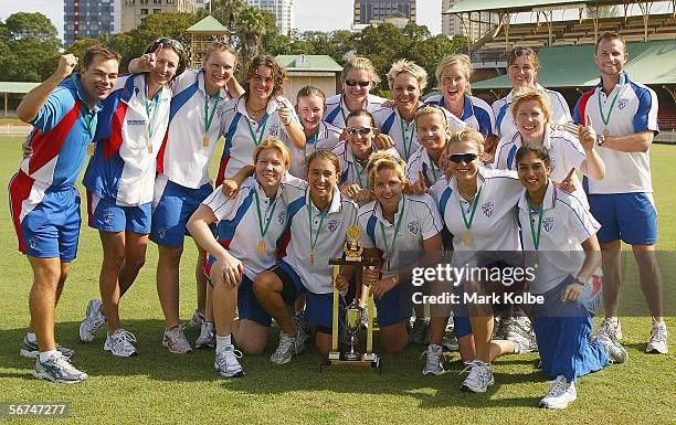 The NSW Breakers celebrate with the trophy after winning the 3rd Final and clinching the series between the New South Wales Breakers and Queensland...