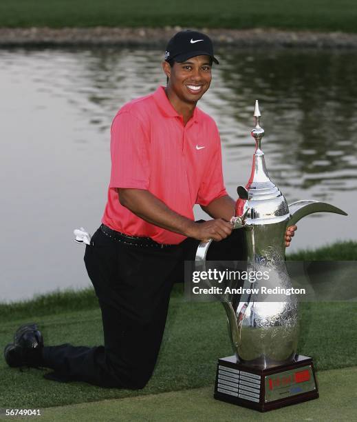 Tiger Woods of the USA poses with the trophy after winning the Dubai Desert Classic on February 5, 2006 on the Majilis Course at Emirates Golf Club...