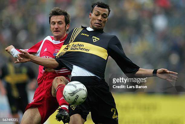 Thomas Sobotzik of Unterhaching challenges Emil Noll of Aachen for the ball during the Second Bundesliga match between Alemannia Aachen and Spvgg...