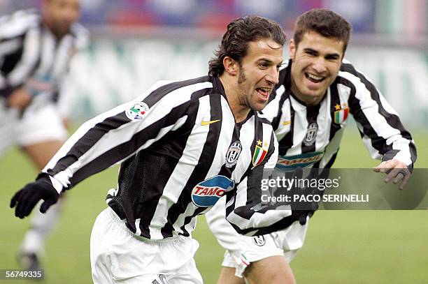 Juventus' forward Alessandro Del Piero is congratulated by his teammate Adrian Mutu after scoring a goal against Udinese during their serie A...