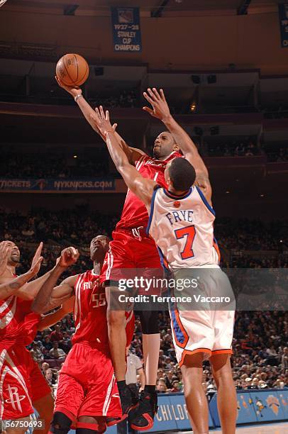 Tracy McGrady of the Houston Rockets shoots against Channing Frye of the New York Knicks on February 5, 2006 at Madison Square Garden in New York...