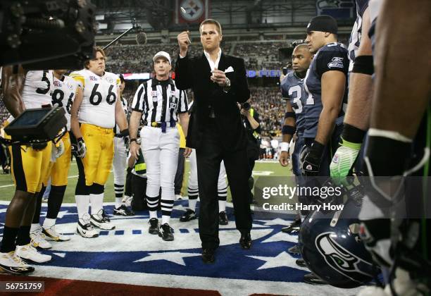 Super Bowl MVP and New England Patriots quarterback Tom Brady performs the coin toss before the start of Super Bowl XL between the Pittsburgh...