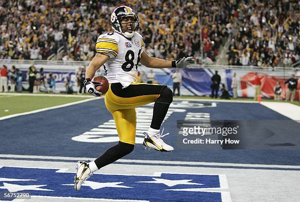 Wide receiver Hines Ward of the Pittsburgh Steelers scores a touchdown on a pass from receiver Antwaan Randle El in front of cornerback Marcus...