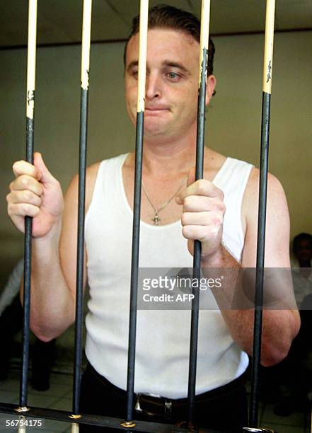 Australian Martin Eric Stephens stands behind bars while waiting for his trial in Denpasar, Bali island, 06 February 2006. Stephens told the Denpasar...