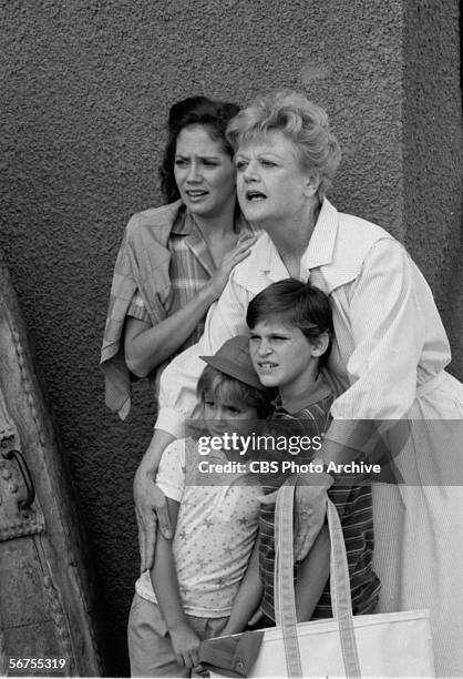 British-born actress Angela Lansbury protects American sibling child actors Summer Phoenix and River Phoenix and actress Anne Kerry in a scene from...
