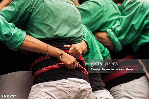 castellers performing during la mercè festival - castell stock pictures, royalty-free photos & images