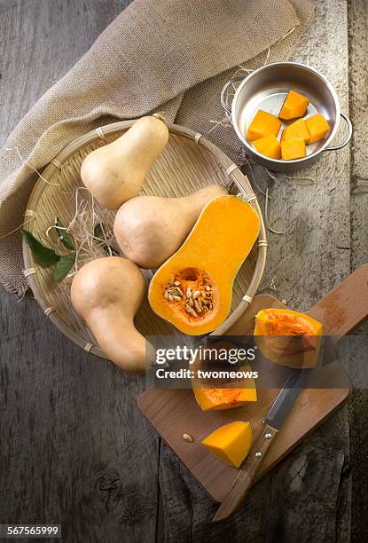 butter squash cut open on wooden table top - nut butter stock pictures, royalty-free photos & images