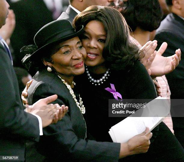 Television celebrity Oprah Winfrey embraces Christine King Farris, sister of Dr. Martin Luther King Jr. As they attend a musical tribute for Coretta...