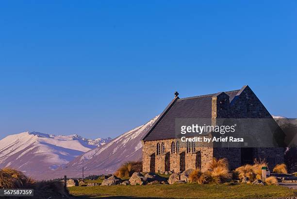 solitary church with mountain background - church of the good shepherd tekapo stock pictures, royalty-free photos & images