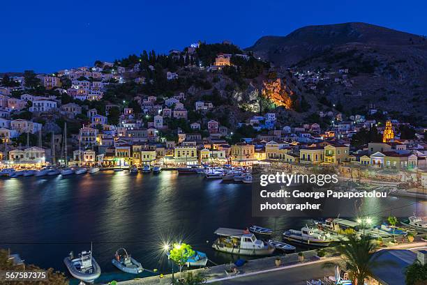 port of symi island at night - symi ストックフォトと画像