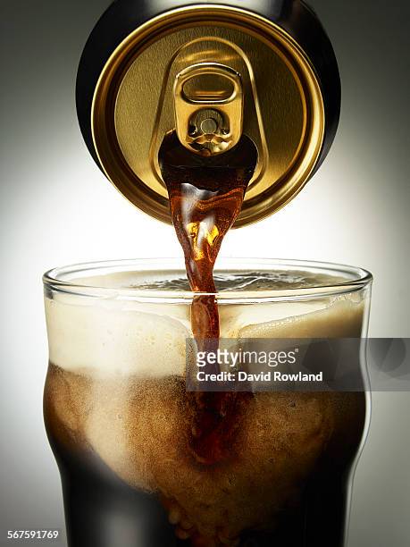 stout beer pouring from a can into a glass - stoutöl bildbanksfoton och bilder