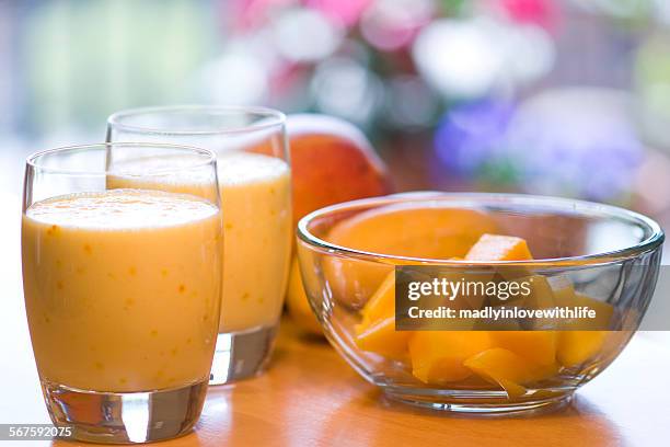 sweet mango lassi drinks - lassi stock-fotos und bilder