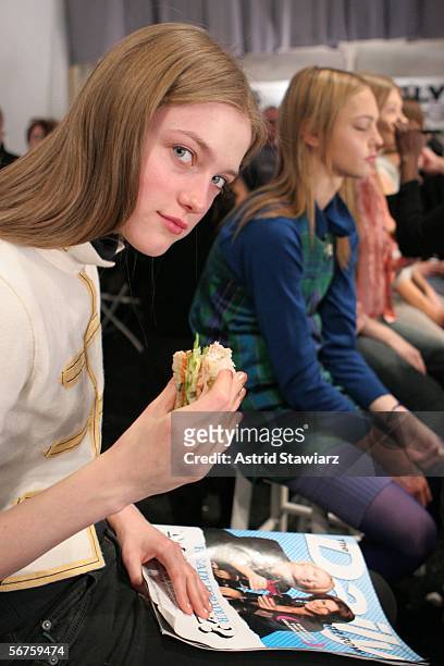 Model eats backstage at the Reem Acra Fall 2006 fashion show during Olympus Fashion Week at Bryant Park February 6, 2006 in New York City.