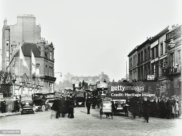 Fulham Road by Stamford Bridge Stadium, , Fulham, London, 1912. People, cars and buses are crowded outside the entrance to the ground.