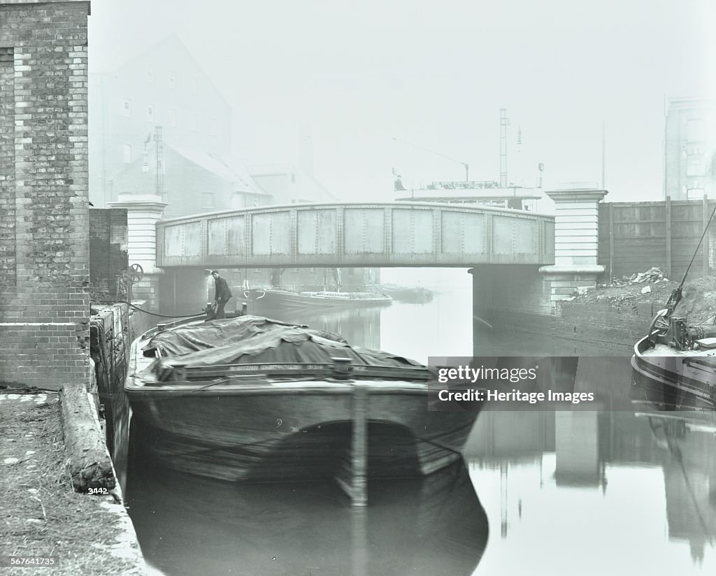 Man Mooring A Barge By A River Bank, Poplar, London, 1905