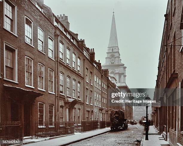 Georgian terraced houses and Christ Church, Fournier Street, Spitalfields, Stepney, London, 1909. Street of three-storey Georgian terraced houses,...