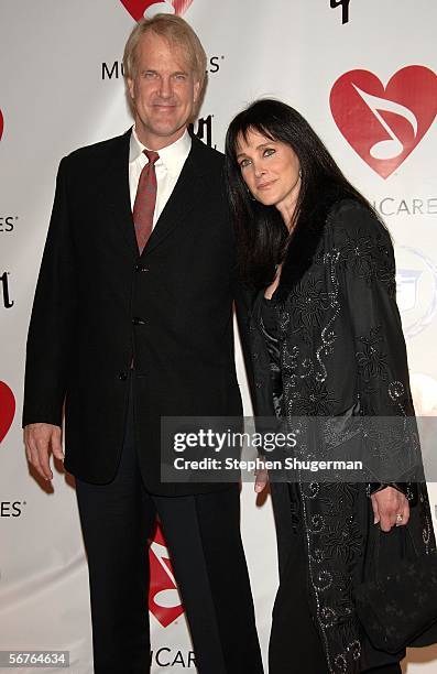 Musician John Tesh and actress Connie Sellecca arrive at the 2006 MusiCares Person of the Year honoring James Taylor at the Los Angeles Convention...