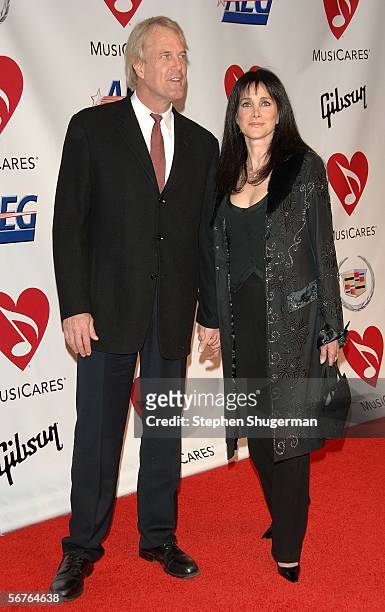 Musician John Tesh and actress Connie Sellecca arrive at the 2006 MusiCares Person of the Year honoring James Taylor at the Los Angeles Convention...