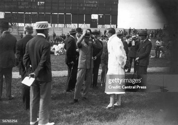 The Prince of Wales, later Edward VIII talking to British runner Harold Abrahams after his 200-metre first-round heat at the Olympic Games, Colombes...