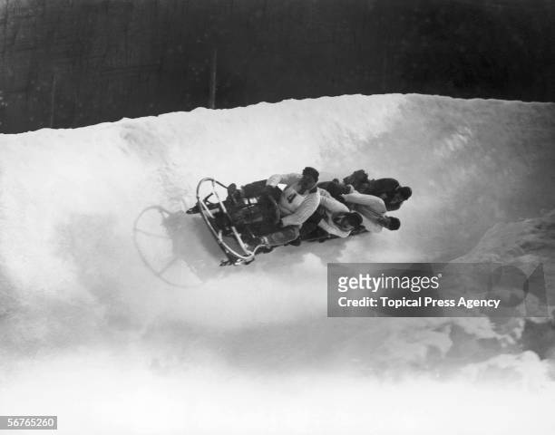 The British four-man bobsleigh team in action at the Winter Olympics at Chamonix, February 1924. The team, Ralph Broome, Thomas Arnold, Alexander...